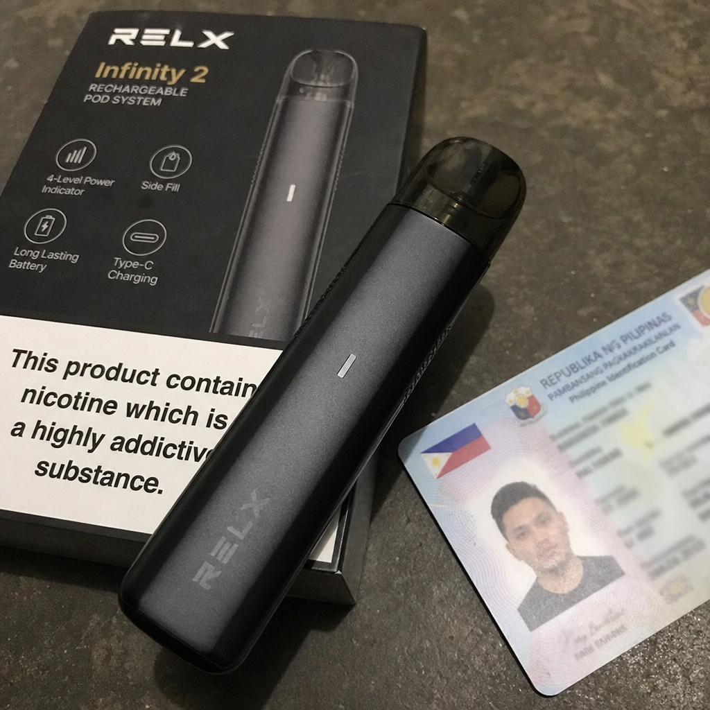 Black RELX pod vape device resting on its retail packaging next to a government ID card illustrating age verification requirements - How to Buy a Vape guide by VapeFeat