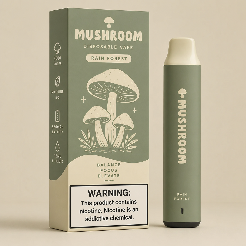 Sage green Mushroom Disposable Vape in Rain Forest flavor with 5000 puffs, 5% nicotine, and 650mAh battery standing beside its packaging box - mushroom disposable vape review by VapeFeat