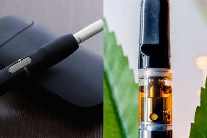 Split comparison of a heated tobacco device next to an amber cannabis oil vape cartridge in front of a green leaf - Dab Pen vs Vape Pen guide by VapeFeat