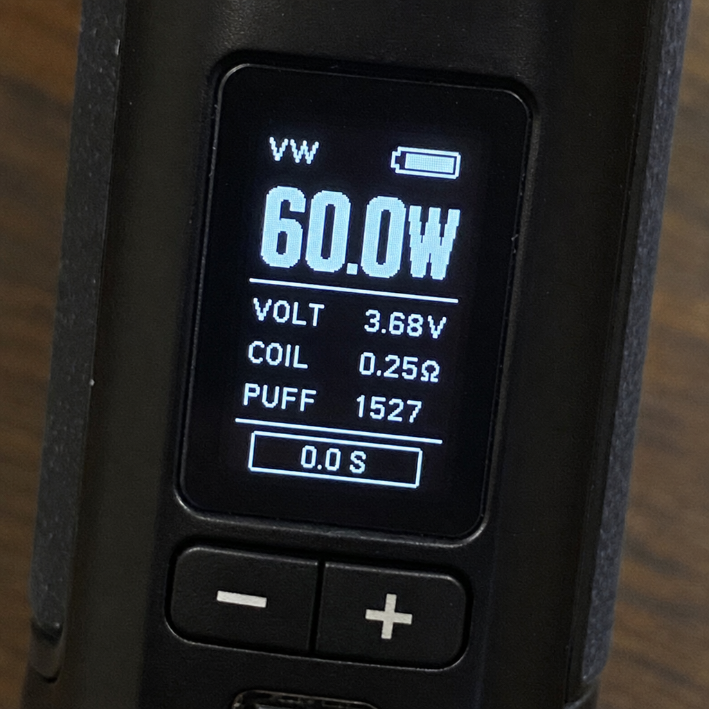 Vape mod digital screen showing wattage, voltage, and coil resistance on VapeFeat