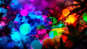 Vibrant neon multicolored US map with cannabis leaf silhouettes and colorful glowing bokeh background - Cannabis Legalization by State Guide on VapeFeat